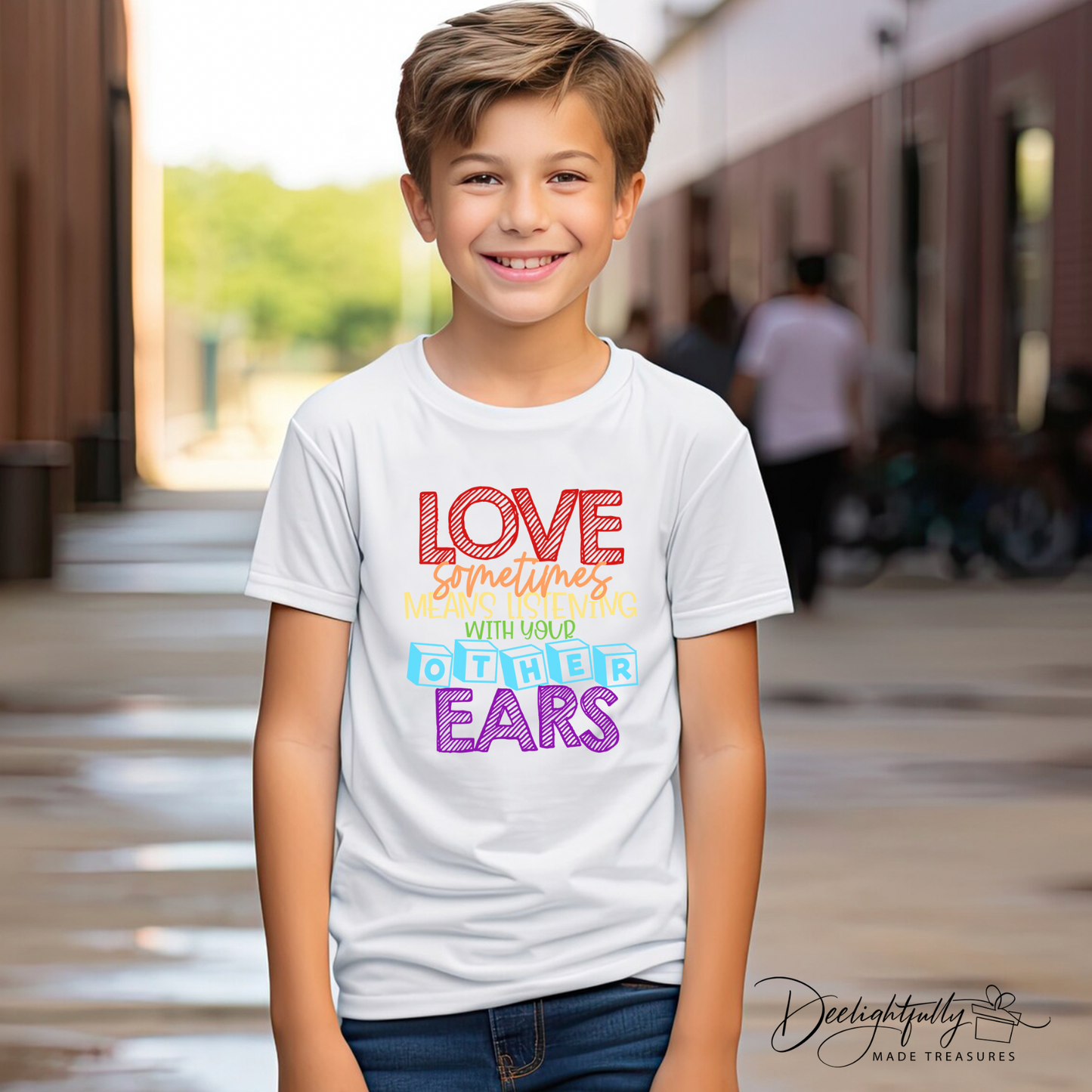 Boy wearing a white Bella + Canvas crewneck t-shirt with an autism awareness design.