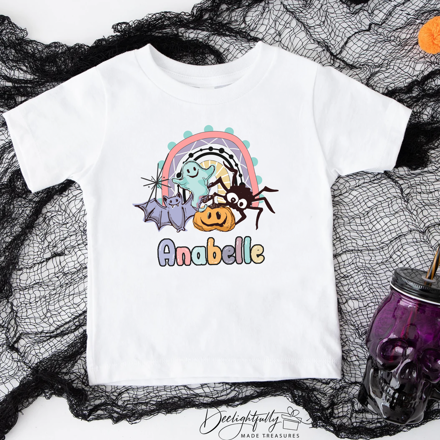 White Bella + Canvas crewneck shirt with Halloween bat, ghost, pumpkin, spider design.